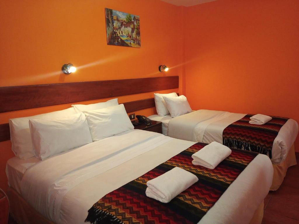 Postel nebo postele na pokoji v ubytování Hotel Rio Dorado MachuPicchu
