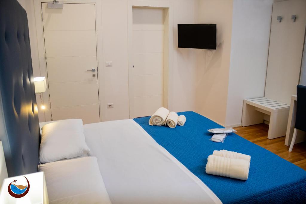 Łóżko lub łóżka w pokoju w obiekcie Beauty House Via Veneto