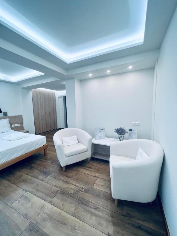 Postel nebo postele na pokoji v ubytování Rozos Hotel