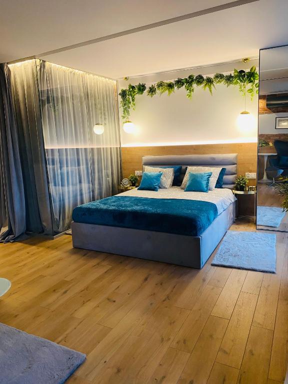 Posteľ alebo postele v izbe v ubytovaní Apartament MoLoo III