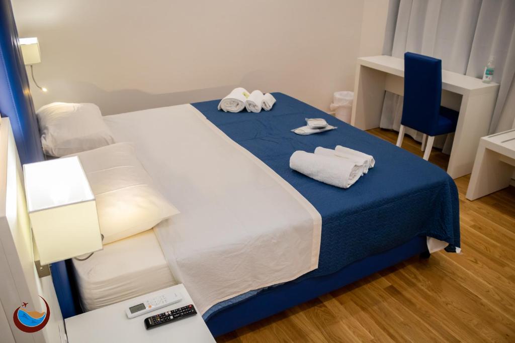 Łóżko lub łóżka w pokoju w obiekcie Beauty House Via Veneto