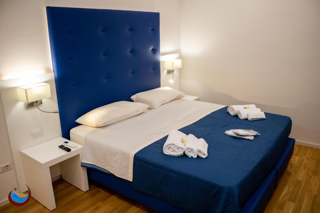 Łóżko lub łóżka w pokoju w obiekcie Beauty House Via Veneto
