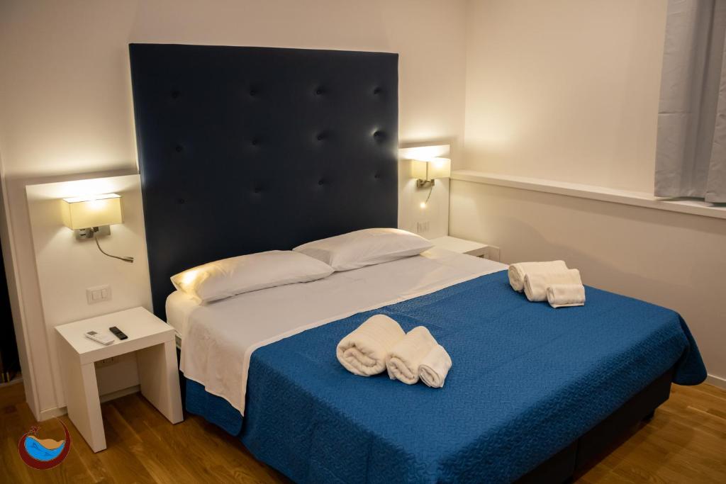 Łóżko lub łóżka w pokoju w obiekcie Beauty House Via Veneto