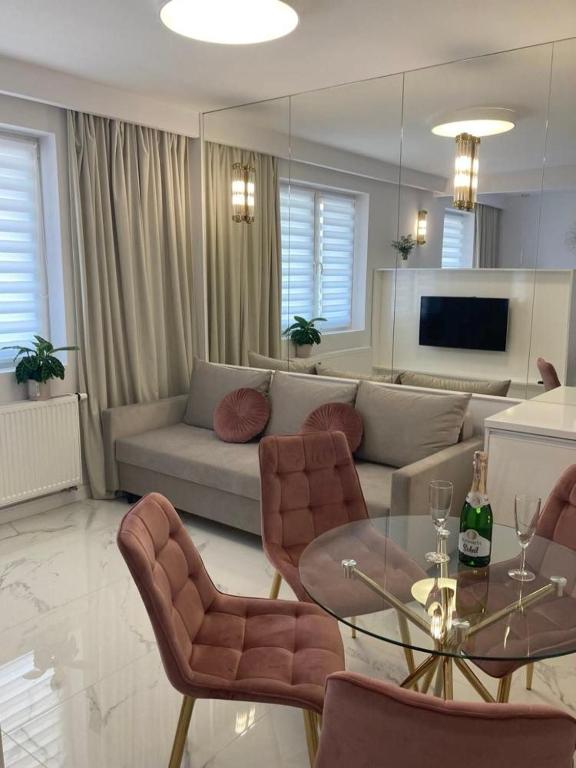 Posedenie v ubytovaní Apartamenty Parkowe B18