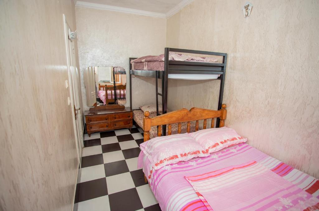 Postel nebo postele na pokoji v ubytování Hostel California