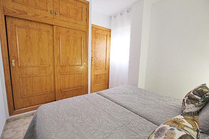 Postel nebo postele na pokoji v ubytování APN Apartamento Playa de Guardamar