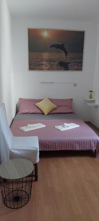 Postel nebo postele na pokoji v ubytování Apartments Julia & Nika