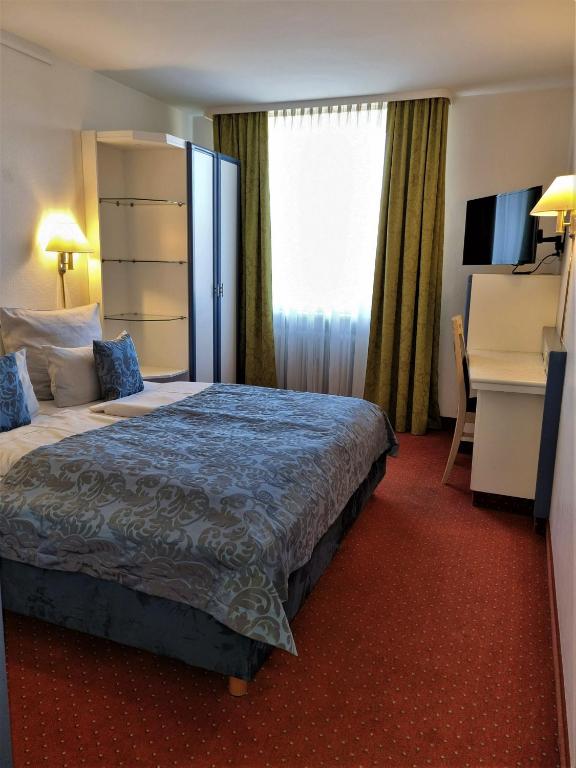 Postel nebo postele na pokoji v ubytování myMINGA13 - Hotel & serviced Apartments