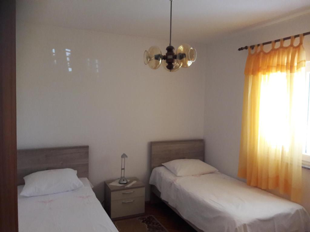 Postel nebo postele na pokoji v ubytování Apartment Bise