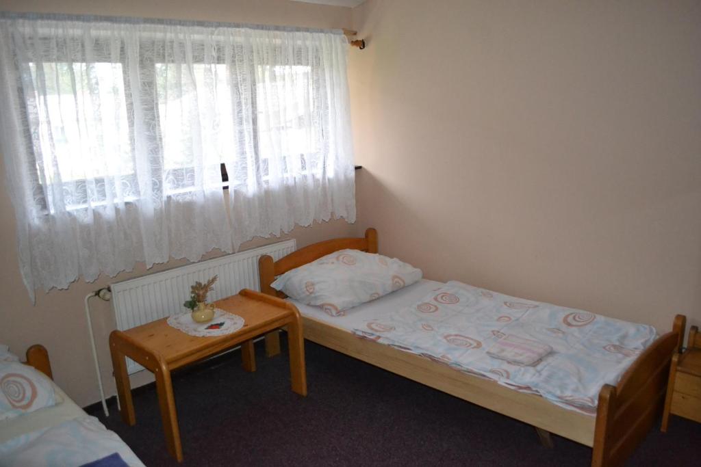 Postel nebo postele na pokoji v ubytování Penzion Tágo Bohumín