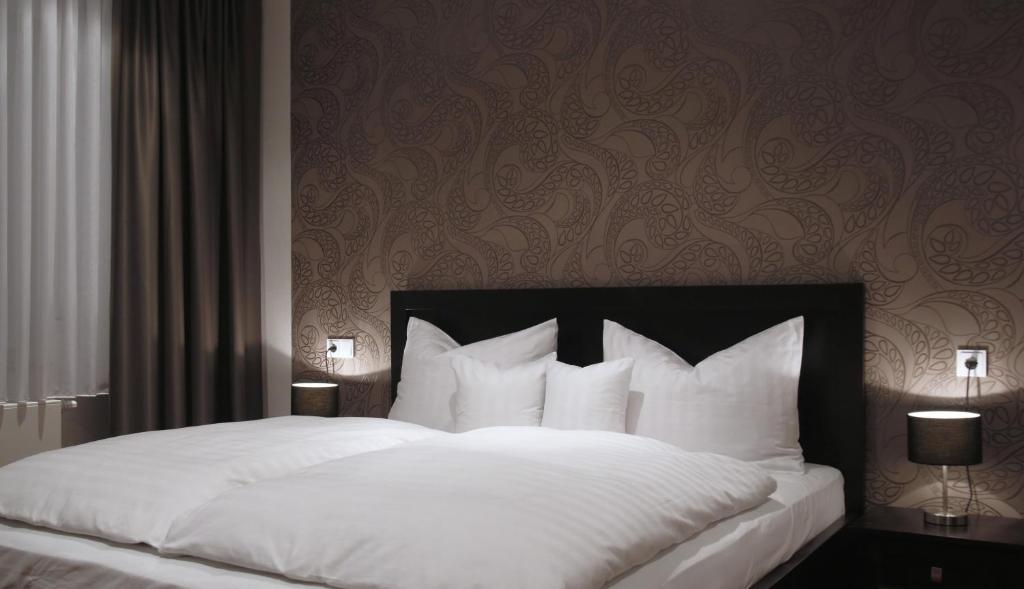 Postelja oz. postelje v sobi nastanitve Limes Hotel
