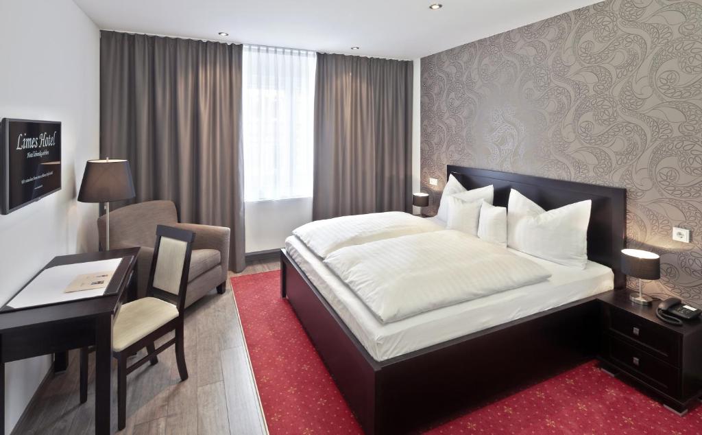 Postel nebo postele na pokoji v ubytování Limes Hotel