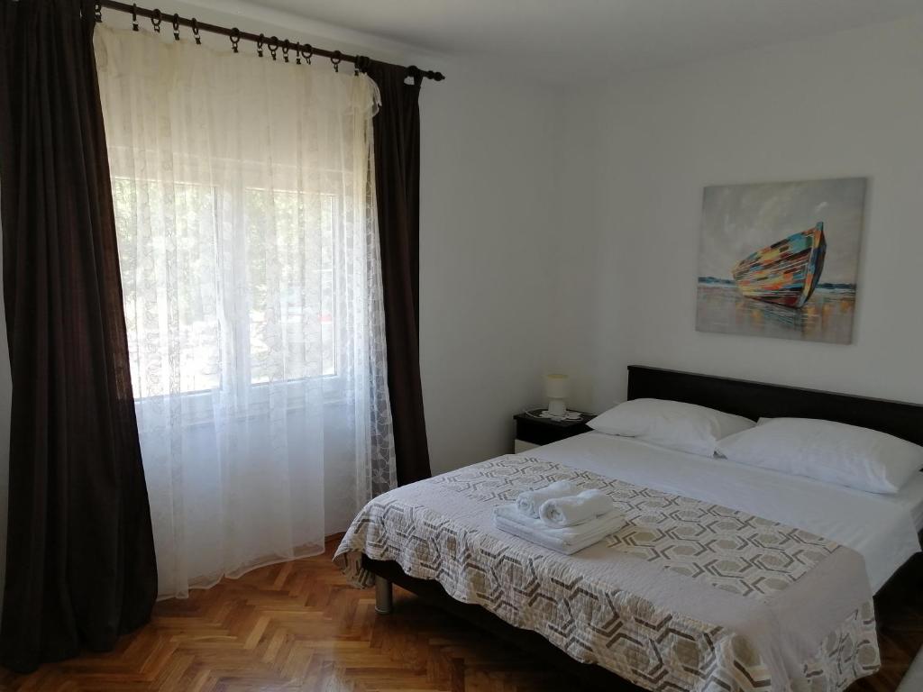 Postel nebo postele na pokoji v ubytování Holiday house Tunjarice