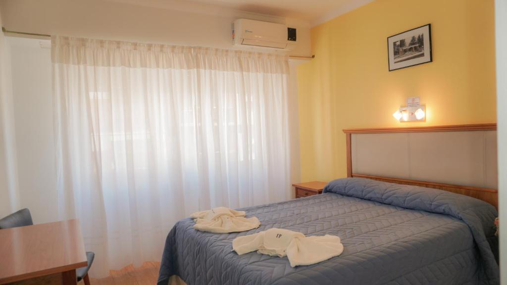 Postel nebo postele na pokoji v ubytování HOTEL 3 DE ABRIL