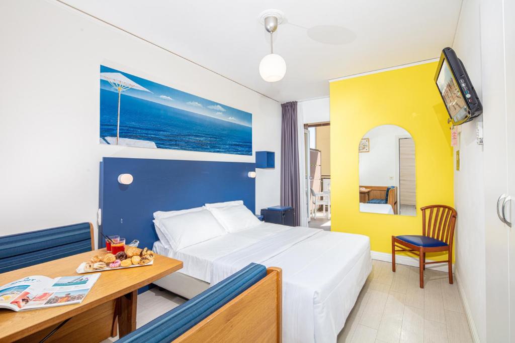 Postel nebo postele na pokoji v ubytování Hotel Alexander