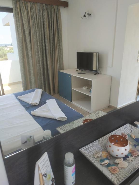 Postel nebo postele na pokoji v ubytování Hotel Narkissos