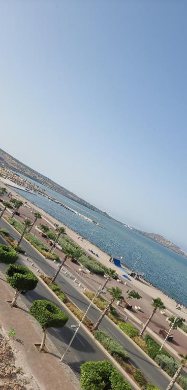 an aerial view of a road next to the water at RESIDENCE LA CORNICH in Nador