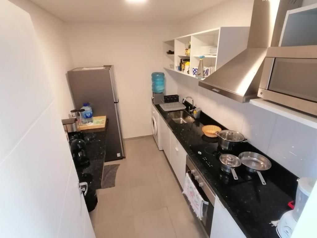 Kuchyň nebo kuchyňský kout v ubytování Parana Playa 1103