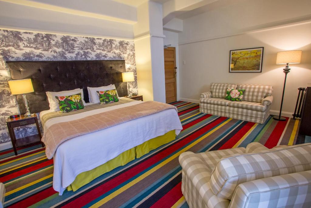 Postel nebo postele na pokoji v ubytování Art Deco Masonic Hotel