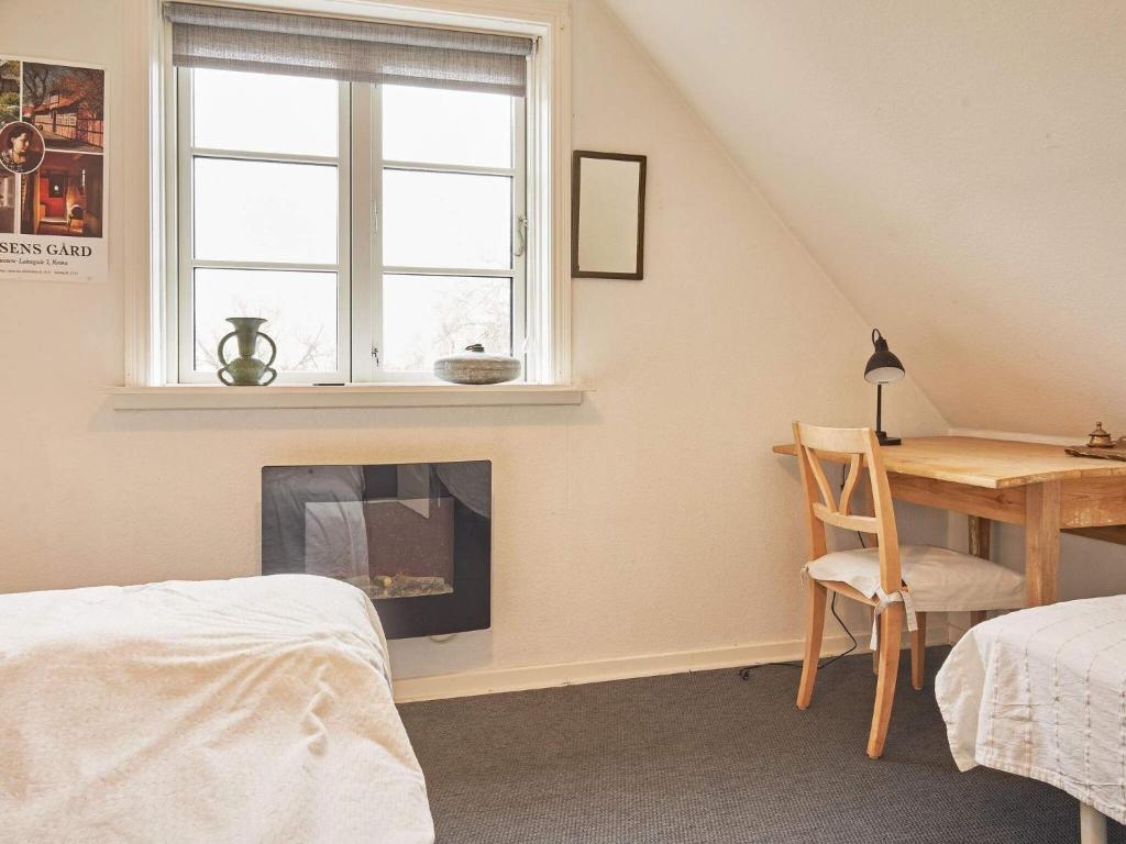 Postel nebo postele na pokoji v ubytování Holiday home Aakirkeby IX