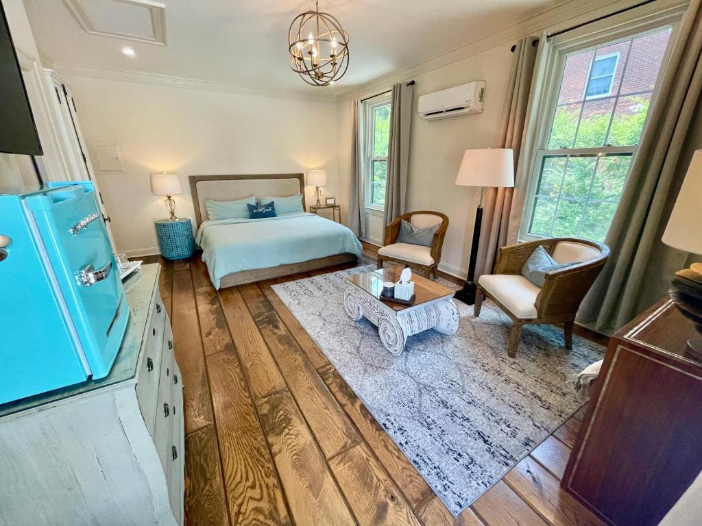 a bedroom with a bed and a table at 5 stars in Eastover in Charlotte