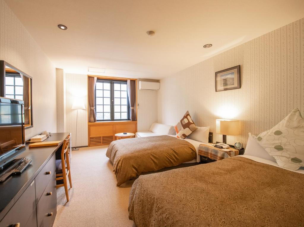 TV a/nebo společenská místnost v ubytování Tabist Hotel Colosseum Inn Tateshina