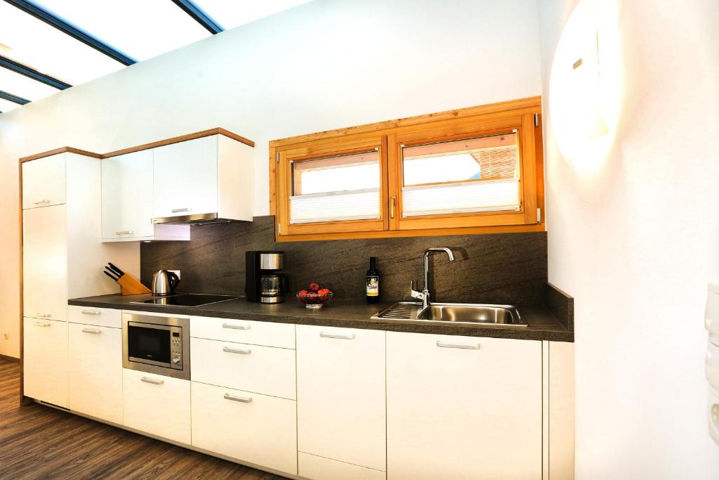 Kuchyňa alebo kuchynka v ubytovaní Sunup Appartements Sölden