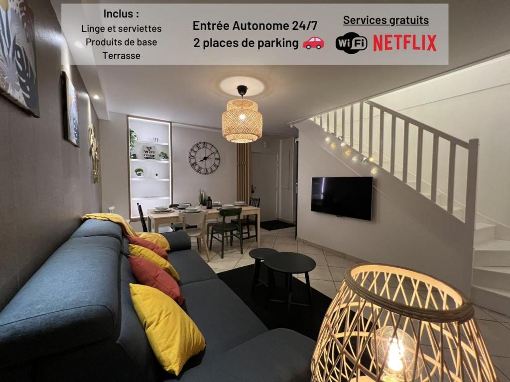 a living room with a couch and a dining room at T3 Flat Moderne sur 2 étages Metro Parking Free Entrance autonome in Rouen
