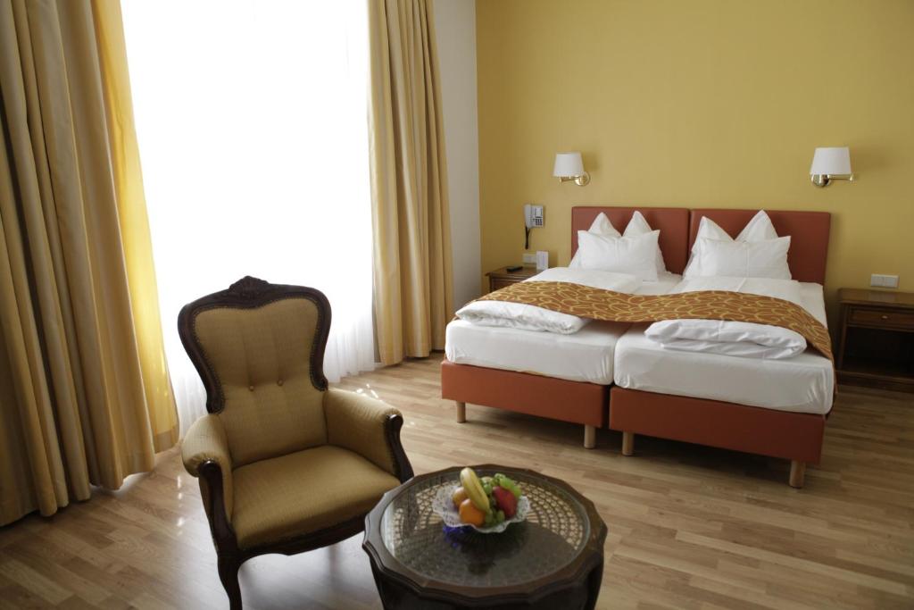 Uma cama ou camas num quarto em Hotel Domizil