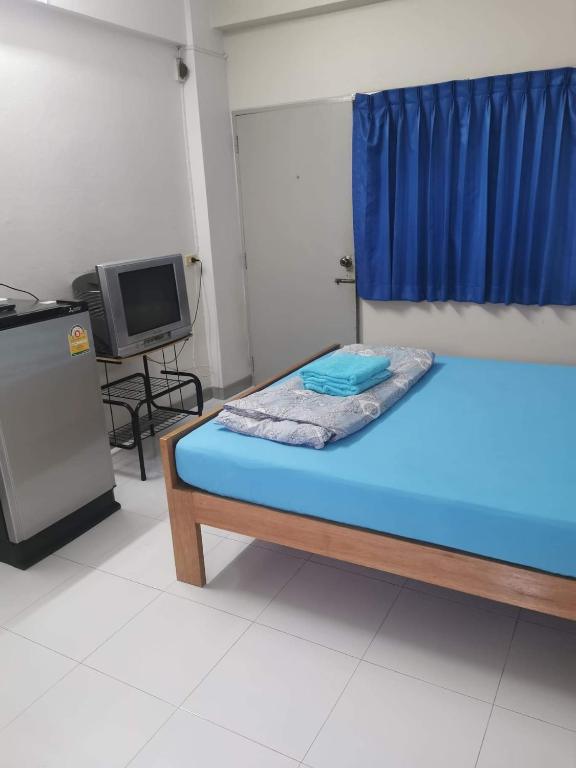 Postel nebo postele na pokoji v ubytování Thanya Mansion