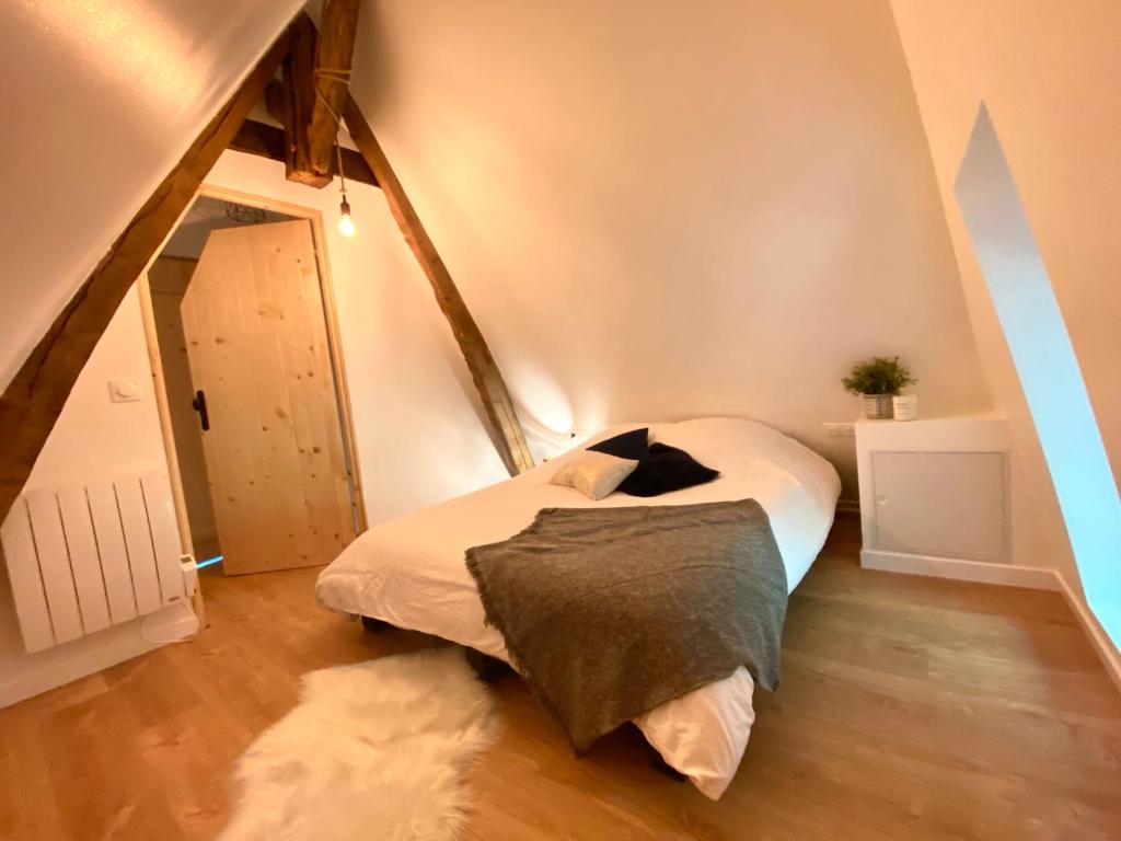 Een bed of bedden in een kamer bij Le Domaine Caribou