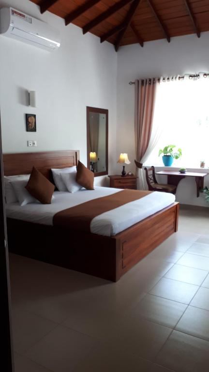 Postel nebo postele na pokoji v ubytování Jal,Min Homestay