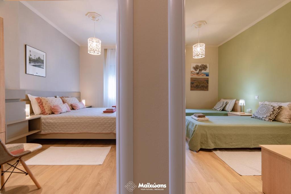 Postel nebo postele na pokoji v ubytování HELIANTHOS VILLA - APARTMENT No2