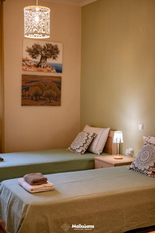 Postel nebo postele na pokoji v ubytování HELIANTHOS VILLA - APARTMENT No2