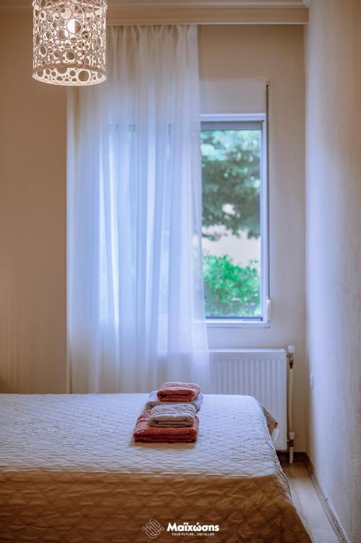 Postel nebo postele na pokoji v ubytování HELIANTHOS VILLA - APARTMENT No2