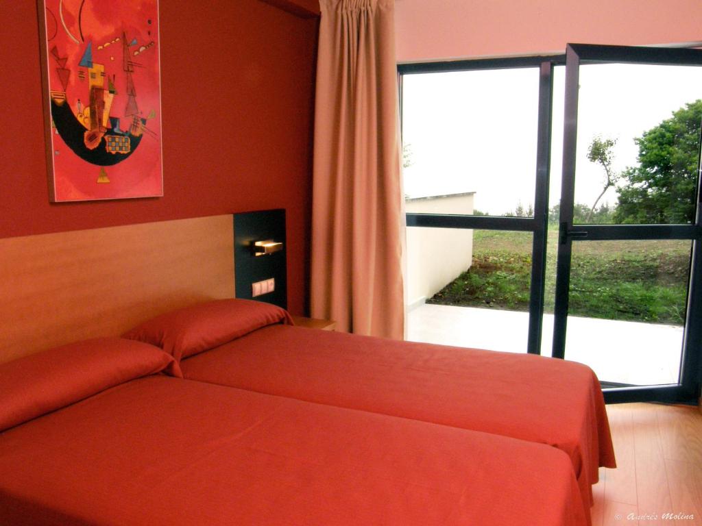 Cama o camas de una habitación en Hotel Parrilla el Zangano