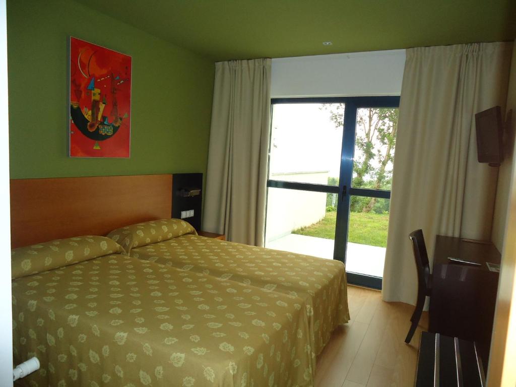 Cama o camas de una habitación en Hotel Parrilla el Zangano