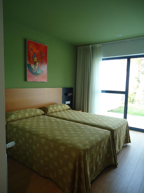 Cama o camas de una habitación en Hotel Parrilla el Zangano