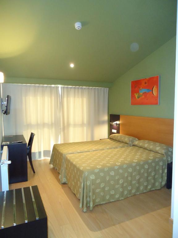 Cama o camas de una habitación en Hotel Parrilla el Zangano