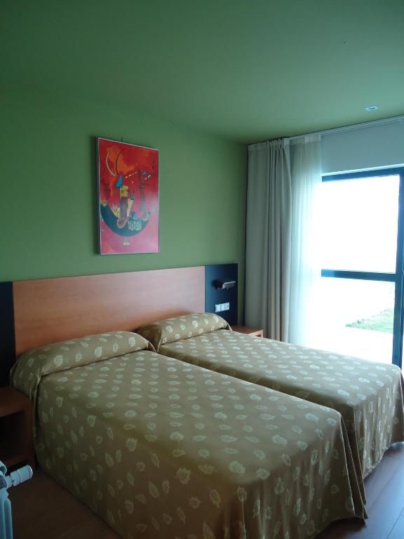 Cama o camas de una habitación en Hotel Parrilla el Zangano