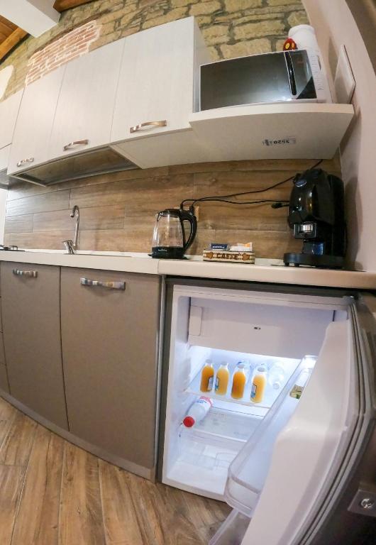Kuchyň nebo kuchyňský kout v ubytování B&B L'Arenaria