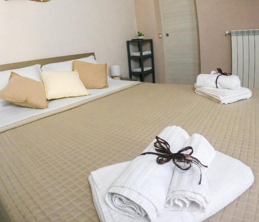 Postel nebo postele na pokoji v ubytování B&B L'Arenaria
