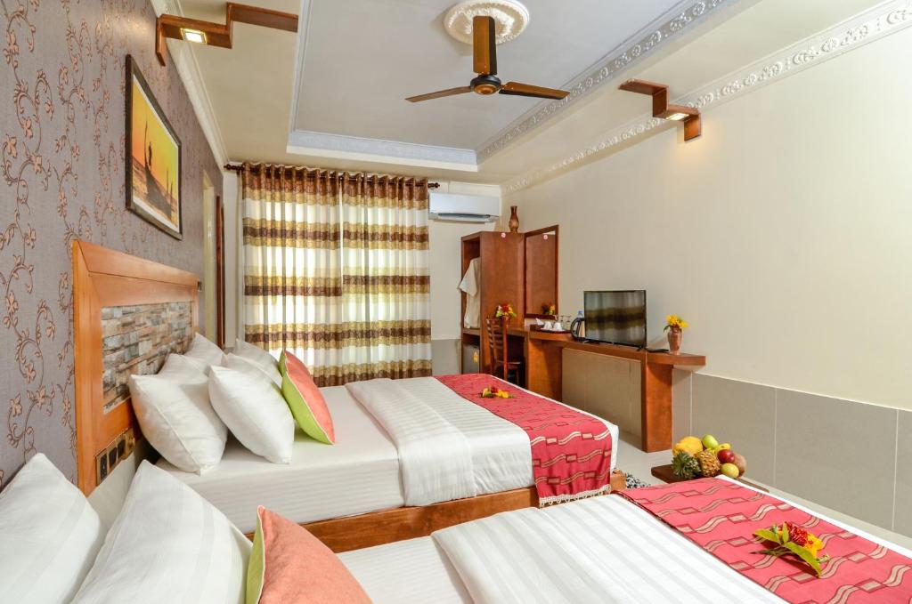 Postel nebo postele na pokoji v ubytování Maladiwa Beach & Spa