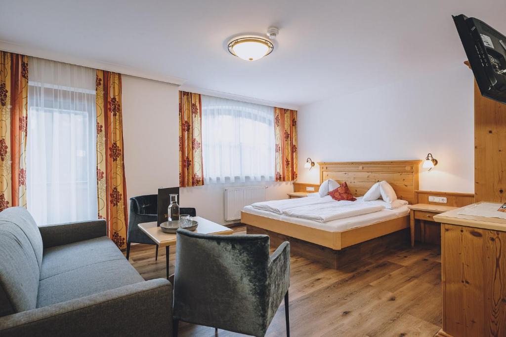Rúm í herbergi á Hotel Vorderronach