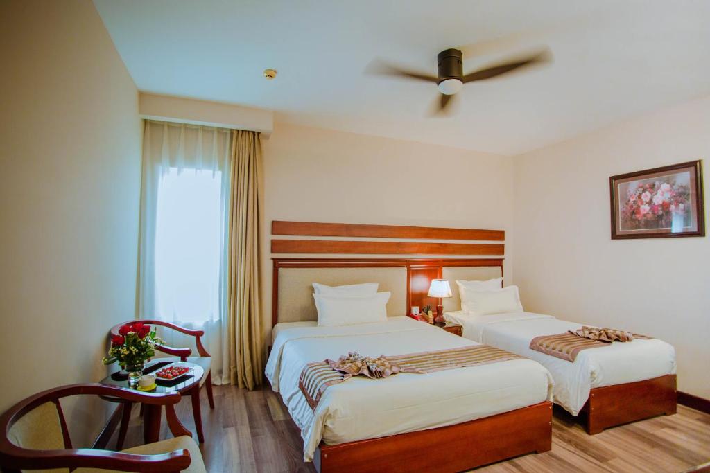 Minh Toan Athena Hotelにあるベッド