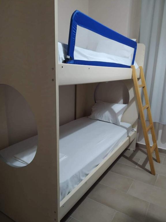 A bed or beds in a room at Ammos Apartments