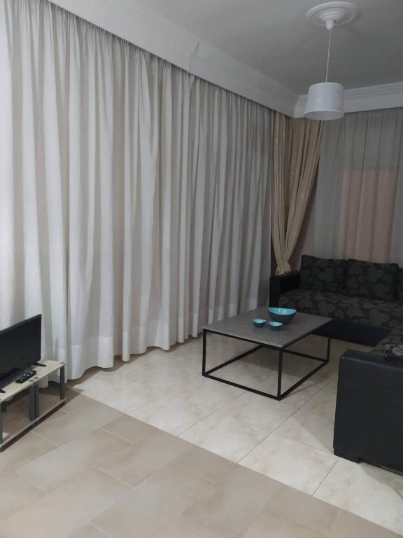 A television and/or entertainment centre at Ammos Apartments