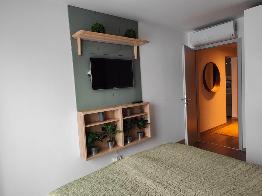 A bed or beds in a room at Beachfront Paradise Ezüst Panoráma lakeview apartment with panoramic terrace