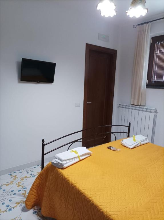 Postel nebo postele na pokoji v ubytování Vivere a colori