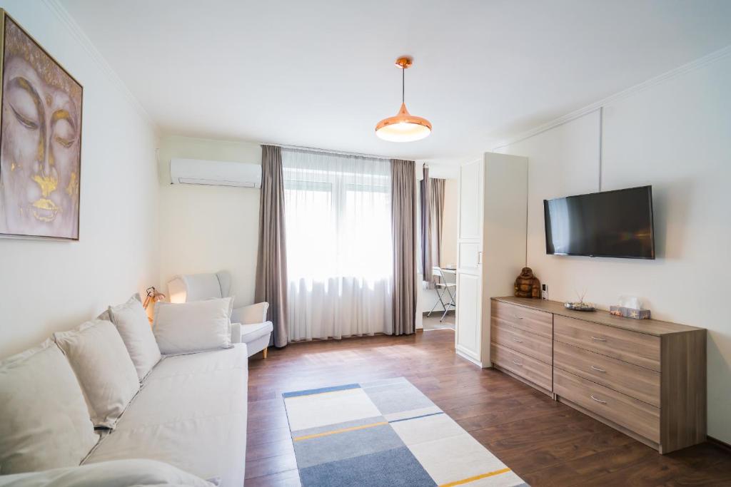 Televízia a/alebo spoločenská miestnosť v ubytovaní Phoenix Apartman Siófok